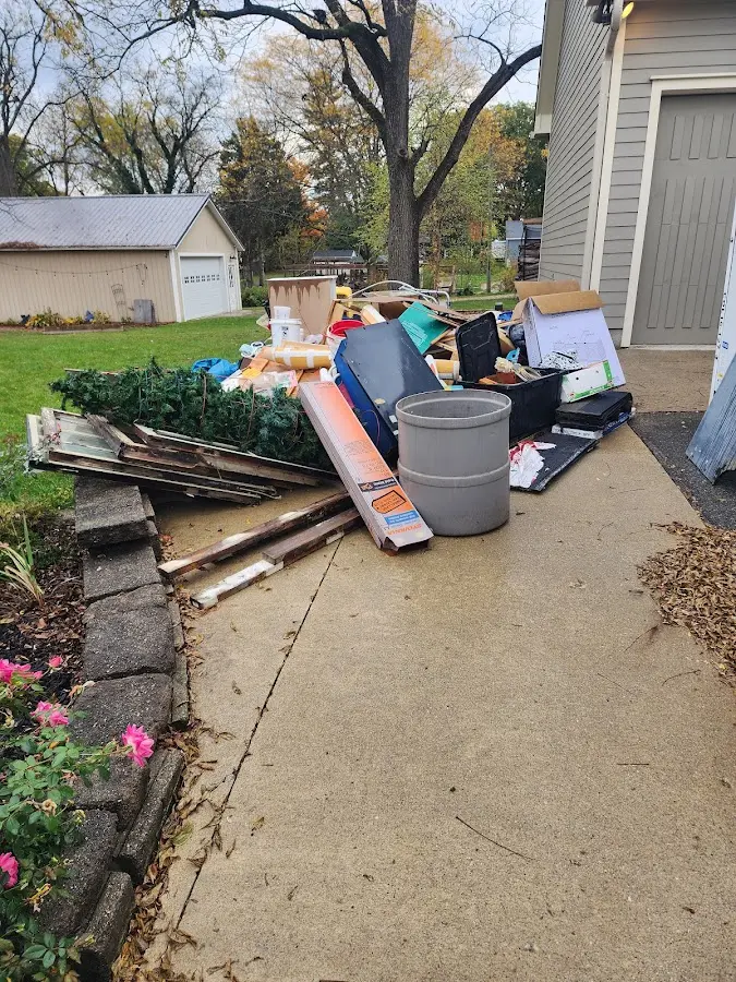 Dumpster being loaded with debris for 3 Yard Dumpster Rental in Gardnerville